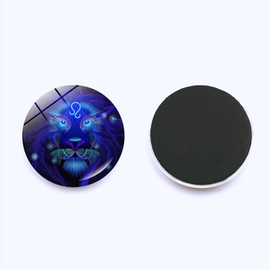 Macro detail of Leo zodiac glass fridge magnet showing blue neon art and magnetic base
