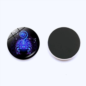 Detailed view of Scorpio zodiac glass fridge magnet with magnetic back and luminous blue design