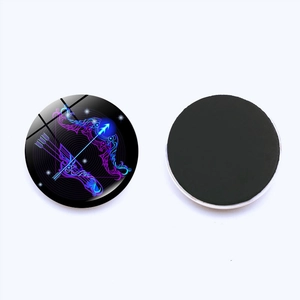 Detail of round Sagittarius glass fridge magnet with vibrant purple zodiac art and magnetic back