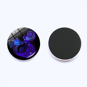 Zodiac Aquarius glass fridge magnet with glowing purple star pattern and magnetic back