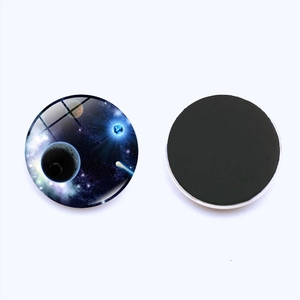 Detail view showing front galaxy glass dome and back magnetic layer of the fridge magnet