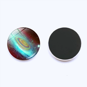 Macro view of 30mm galaxy nebula crystal glass fridge magnet with magnetic back
