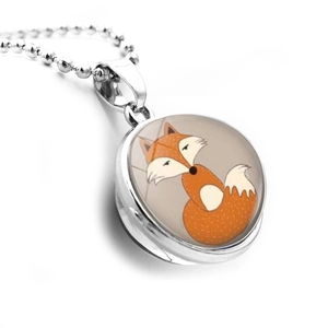 Close-up of double-sided glass ball fox pendant with a polished silver bead chain