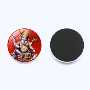 Macro detail of a 30mm glass fridge magnet featuring the Hindu deity Ganesha