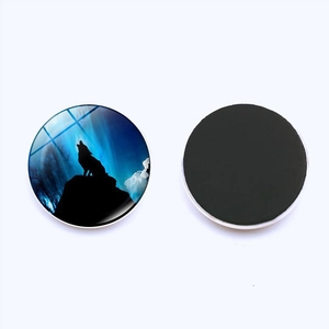 Detailed view of 25mm howling wolf glass fridge magnet with galaxy art and magnetic back
