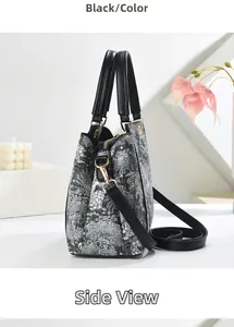 Détail du sac cabas floral avec bordure en cuir noir et garniture dorée élégante