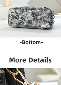 Détail du fond du sac avec quatre clous de protection dorés et broderie florale
