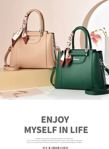 Detailed view of large capacity faux leather handbags with decorative silk scarves