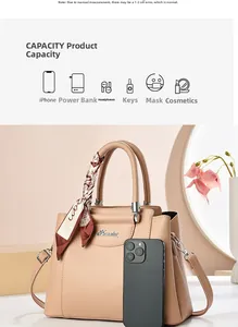 Detail view of large capacity beige handbag with silk scarf and iPhone size reference