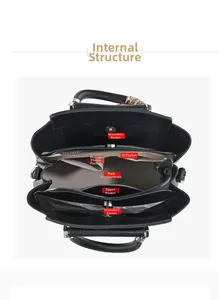 Detailed overhead view of black leather handbag interior compartments and lining