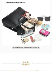 Detailed interior storage view of black pebble leather tote bag showing large capacity
