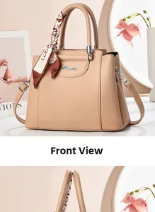 Detailed front view of elegant beige handbag with lychee texture and silk scarf handle