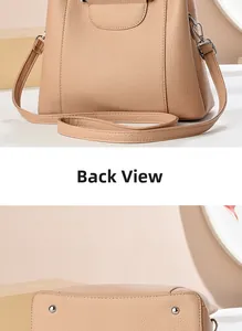 Back view and base detail of a beige pebbled leather handbag with silver protective feet