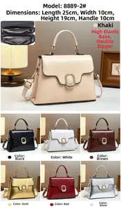 Detailed view of crocodile texture crossbody bag showing 25x10x19cm size and dual compartments