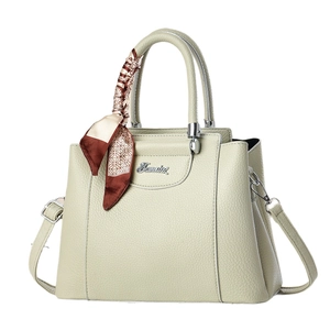 Elegant beige leather handbag for women with silk scarf and silver metal logo detail