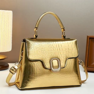Chic gold crocodile pattern crossbody bag with metallic finish and top handle