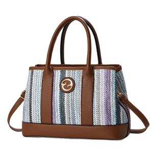 Striped woven bucket bag with brown leather handles and gold metal logo on white background