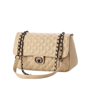 Beige quilted flap shoulder bag with black metal chain strap and twist lock closure
