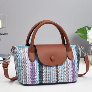 Striped woven shoulder bag with leather handle and decorative buckle for beach vacation