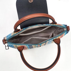 Internal layout of striped woven shoulder bag with herringbone lining and pockets