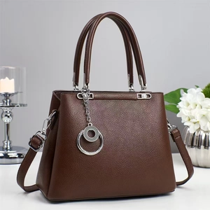 Dark brown lychee pattern leather tote bag with silver ring charm and crossbody strap