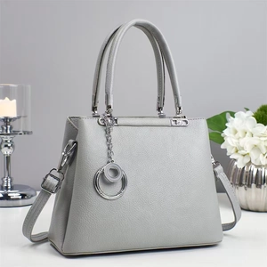 Elegant light gray lychee leather tote bag with silver charm and detachable shoulder strap