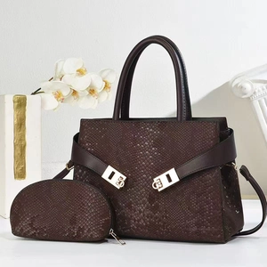 Glossy dark brown snake pattern tote bag and matching coin purse with metal hardware