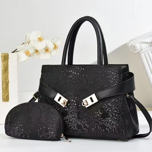 Detail of black snakeskin texture handbag set with silver hardware and matching coin purse