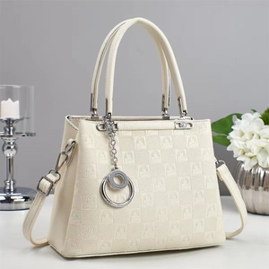 Chic cream white embossed shoulder bag with top handle and silver metal charm pendant