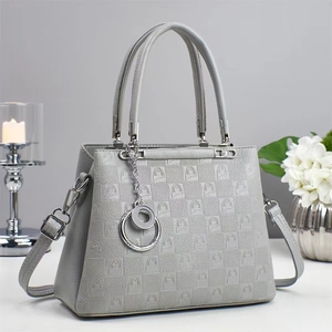 Gray textured shoulder bag with arch pattern and silver dual-ring metallic pendant