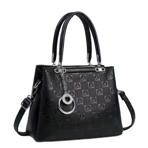 Elegant black checkered embossed handbag with adjustable shoulder strap and metal charm