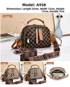 Detailed view of checkered crossbody bag showing interior compartments and top handles