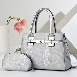 Silver snakeskin tote bag set with metal turn-lock and matching round zipper pouch
