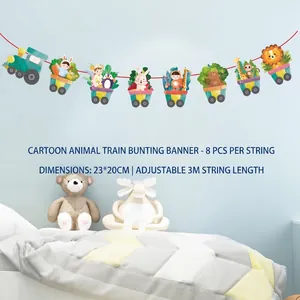 Close-up of animal train party banner with lion and giraffe hanging on blue wall