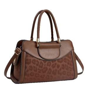Brown leopard print patchwork tote bag with gold hardware and top handles