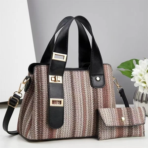 Detailed view of woven straw tote bag and wallet set with brown vertical stripes