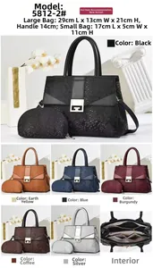 Detail view of the multi-compartment interior and faux snake skin texture of this handbag set