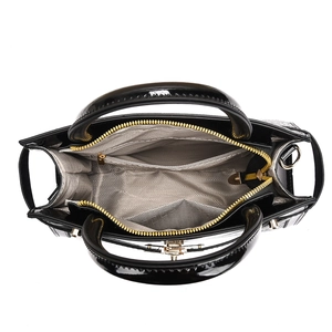 Top view of black patent leather tote bag with multi-compartment interior and chevron lining