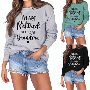 Detail of ribbed crewneck and grandma quote print on three colorful cotton sweatshirts