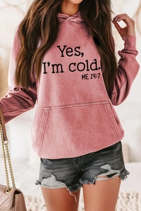 Detail of dusty rose hoodie with Yes I'm cold ME 24:7 text and kangaroo pocket