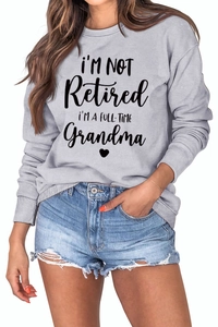Detail of grey crewneck sweatshirt featuring I'M A FULL-TIME Grandma graphic print