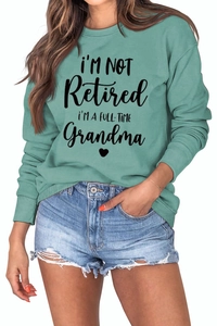 Detailed view of the ribbed cuffs and high-quality knit fabric of the green grandma hoodie