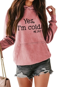 Detail view of the slogan print and kangaroo pocket on this pink hooded sweatshirt