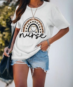 Detail of white cotton nurse t-shirt with rainbow leopard heart print and denim shorts