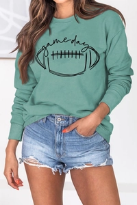 Gros plan du sweat Game Day vert menthe avec poignets côtelés et texture en coton mélangé