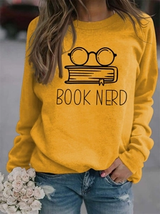 Detail of yellow long sleeve sweatshirt with Book Nerd glasses and books print