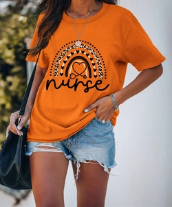 Detail of orange nurse t-shirt featuring leopard print rainbow and stethoscope heart