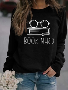 Detail of Book Nerd print on a black long sleeve sweatshirt with glasses and books