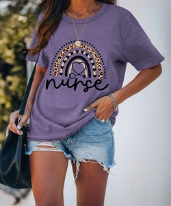 Detail of purple nurse t-shirt featuring leopard rainbow print and stethoscope heart