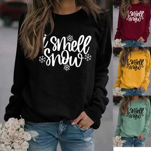 Detail view of colorful long sleeve sweatshirts featuring I smell snow snowflake print